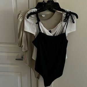 Three Body suits in excellent condition. All size large.